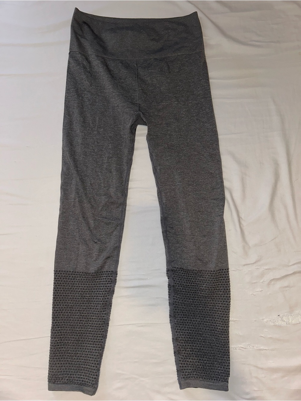 Athletic gray leggings with honeycomb cut out calf detail